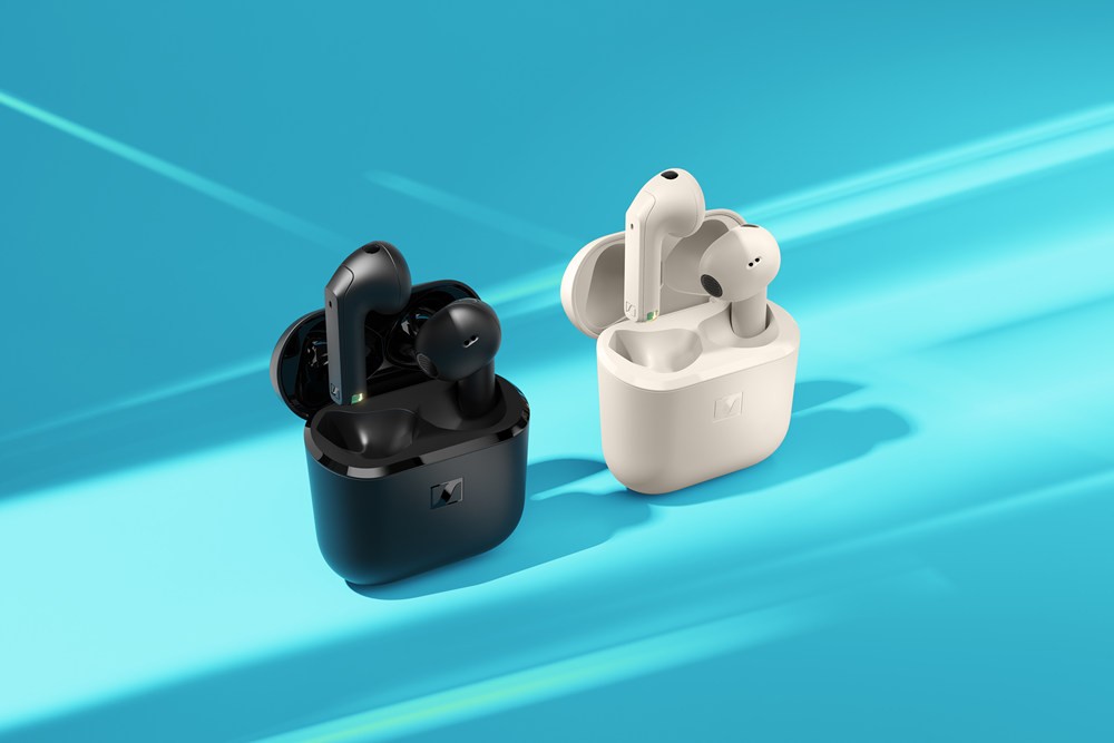 A black and white wireless earbuds

Description automatically generated